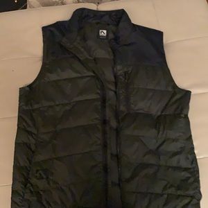 Fly low down vest. Tiny hole in the corner but rarely worn
